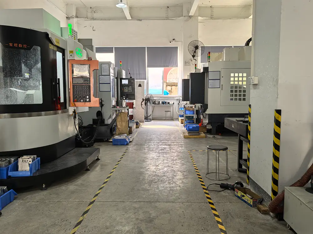 Facilities 2 CNC machining centers arranged along a marked workshop aisle