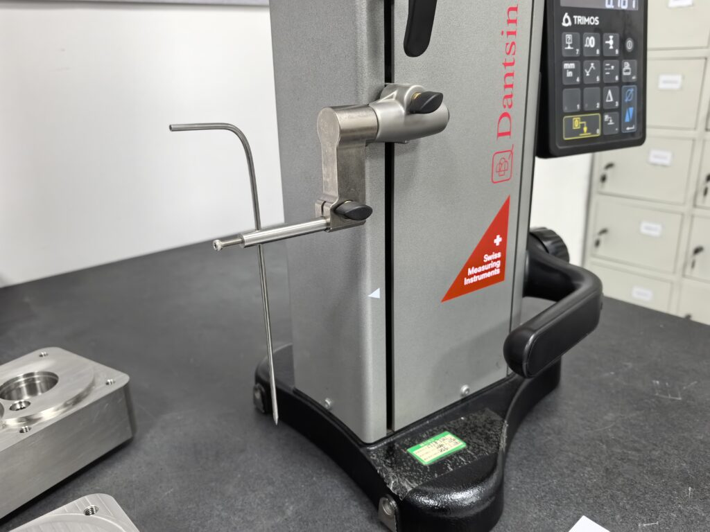 Facilities 7 Digital height gauge and machined components on a granite measuring table