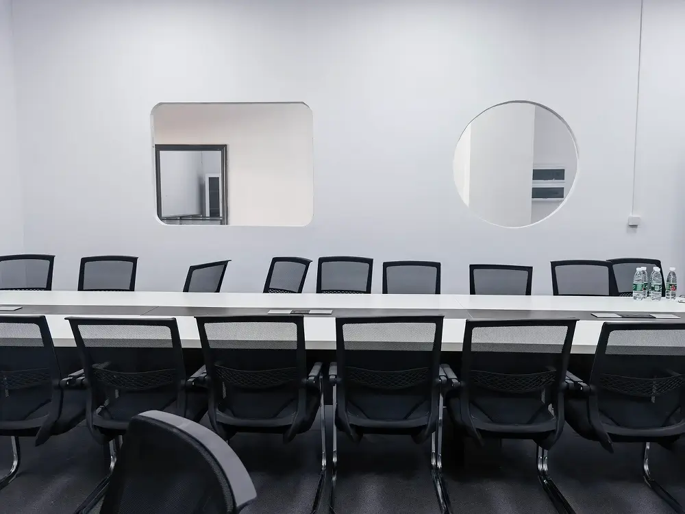 Facilities 8 Conference room with a long meeting table for project discussions